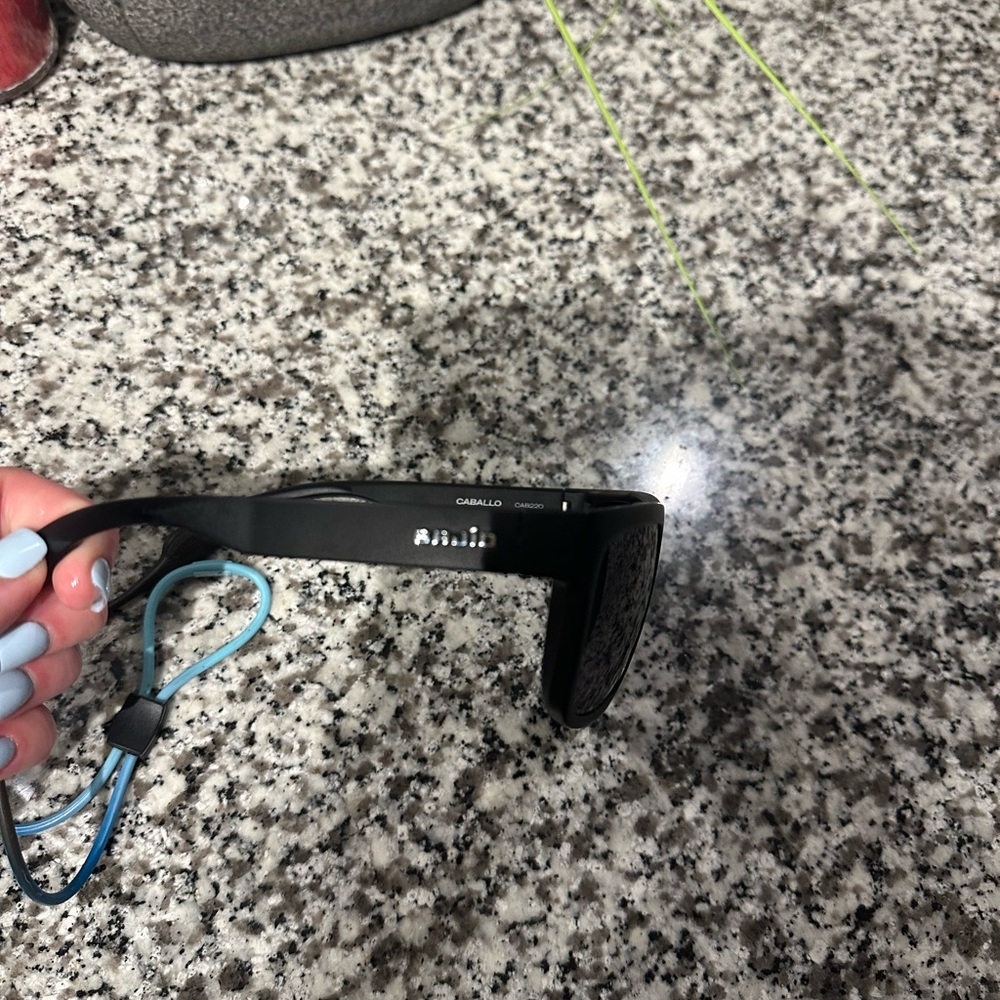 Molo Black Sunglasses with Blue Accents
